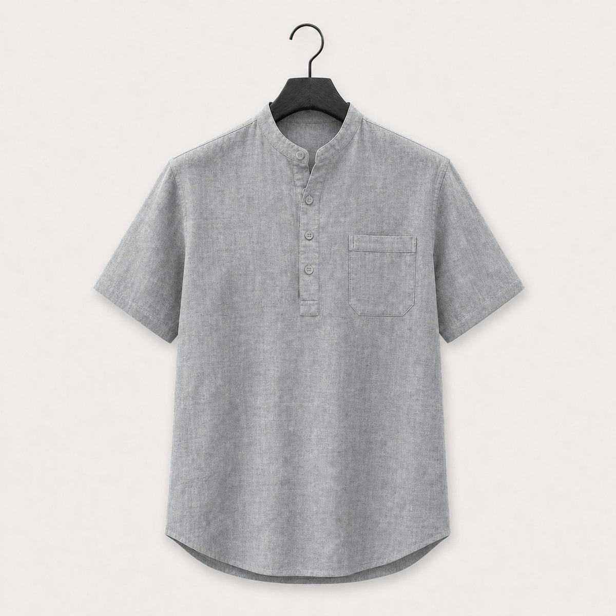 Grey band collar linen blend henley shirt with short sleeves and a chest pocket, shown on a hanger